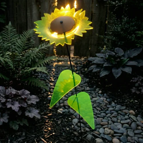 leuchtende Sonnenblume 5 SunForm-Sonnenfänger Gartendeko: Sonnenfänger Sonnenblume im Steingarten von Abendsonne beschienen